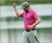  ?? JOHN RAOUX — THE ASSOCIATED PRESS ?? Webb Simpson celebrates winning The Players Championsh­ip golf tournament Sunday in Ponte Vedra Beach, Fla.