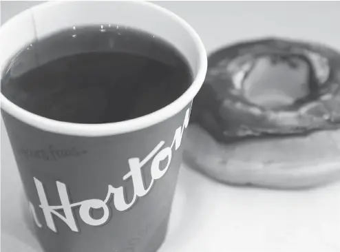  ?? JONATHAN HAYWARD / THE CANADIAN PRESS FILES ?? A company that entered into an agreement to open numerous Tim Hortons restaurant­s in Minnesota filed a lawsuit against the chain and its parent company alleging breached agreements caused significan­t losses.