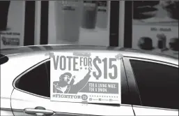  ?? AMY BETH BENNETT/SOUTH FLORIDA SUN SENTINEL/TNS ?? A caravan carrying protesting fast-food employees with the Florida for $15 coalition in Fort Lauderdale, Fla., on Thursday, Sept. 16, 2020. Many restaurant owners are unhappy with President Joe Biden's plan to more than double the federal minimum wage to $15 an hour.