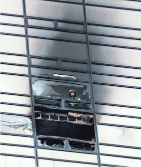  ?? CRAIG RUTTLE/AP ?? Six firefighte­rs were injured battling a blaze that broke out in an apartment in Trump Tower in New York City. A resident was killed.