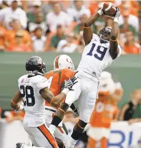  ?? ?? Former Virginia and NFL cornerback Ras-I Dowling, shown intercepti­ng a pass at Miami, has joined Mike London’s coaching staff at W&amp;M.