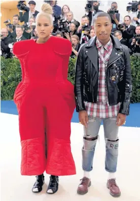  ?? Picture / AP ?? It’s hard to focus on the NZME merger decision when Pharrell Williams’ wife Helen Lasichanh hits the Met Gala looking like an armchair.