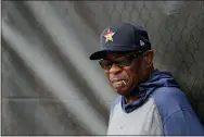  ?? JEFF ROBERSON — THE ASSOCIATED PRESS ?? Astros manager Dusty Baker leans against a fence during spring training practice Thursday in West Palm Beach, Fla.