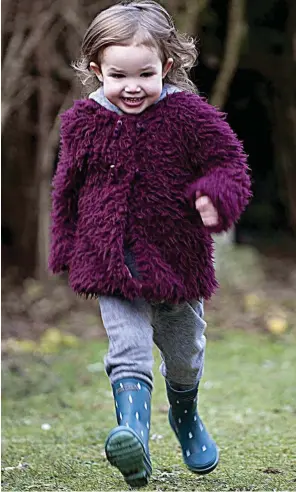  ??  ?? Full of life: Rubi Paice playing in the garden of her Inverurie home