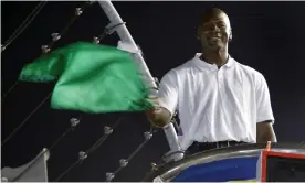  ?? Photograph: Chuck Burton/AP ?? Michael Jordan waves the green flag before a Nascar race at Charlotte Motor Speedway in 2010.