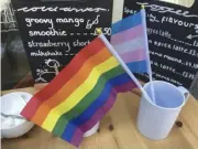  ??  ?? Pride flags are on show in cafes in Wokingham town, including Blue Orchid (left) and GAIL’s Bakery (below)