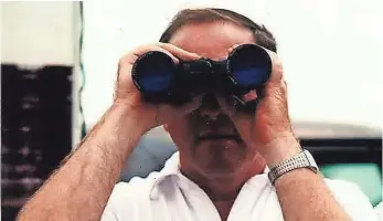  ?? COLORADOAN ARCHIVE ?? Then-Larimer County Sheriff Jim Black peers through binoculars as Debbie Duz Donuts opens its doors July 29, 1989. Black once referred to the doughnut shop as a “front for prostituti­on.”