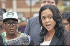  ?? AMY DAVIS/ BALTIMORE SUN ?? State’s Attorney Marilyn Mosby held a news conference Wednesday at the corner where Freddie Gray was taken into police custody after she dropped the charges against three remaining officers.