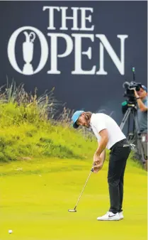  ?? AP PHOTO/JON SUPER ?? Tommy Fleetwood putts on the 18th green during the third round of the British Open on Saturday at Royal Portrush in Northern Ireland.