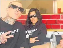  ?? ?? Travis Barker and Kourtney Kardashian at the Wise Boys burger restaurant in Grey Lynn. The star couple happily obliged with requests from customers to have photos taken with them, says Wise Boys boss Luke Burrows.