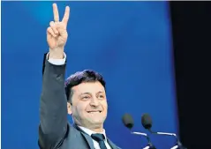  ??  ?? Volodymyr Zelenskiy gestures to the crowd at Kiev’s Olympic Stadium during a presidenti­al debate against Petro Poroshenko, the incumbent who trails in the polls