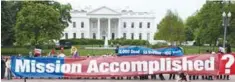  ??  ?? On May 1, 2008 members of the ‘The Iraq Campaign 2008’ held a large replica of ‘Mission Accomplish­ed’ banner in front of the White House.