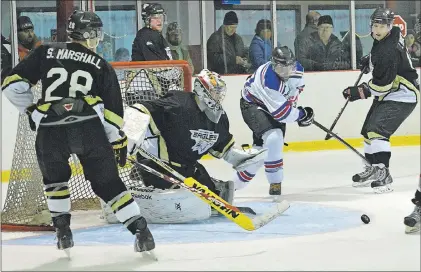  ?? TC MEDIA FILE PHOTO/NICK MERCER/THE COMPASS ?? In this Nov. 7, 2015 file photo, Northeast Eagles’ goaltender Mark Yetman gets ready to pounce on a loose puck before Kenny King of the CeeBee Stars can get his stick on it during Avalon East Senior Hockey League play in Harbour Grace. The Eagles host the first game of the 2016-17 AESHL season tonight at Jack Byrne Arena in Torbay, where a special opening ceremony will highlight the league’s 50-year history.