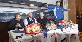  ??  ?? BOLTON: Newly crowned heavyweigh­t world boxing champion Tyson Fury, second left, sits alongside his uncle and trainer Peter Fury, centre right, and agent Asif Vali, left as his father John Fury, right, makes a point at a media day in Bolton, England,...