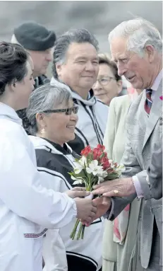  ?? ADRIAN WYLD/THE CANADIAN PRESS ?? Delegates greet Prince Charles as he arrives at the airport in Iqaluit, Nunavut, Thursday.