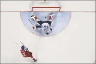  ?? AFP/Getty Images ?? The Czech Republic’s Petr Koukal scores a goal in the men's quarterfin­al match against the U.S. at the Gangneung Hockey Centre in Gangneung on Wednesday.