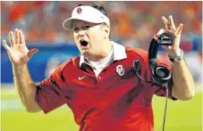  ??  ?? OU coach Bob Stoops said if the ban on satellite camps stands, his staff might consider adding an additional summer camp in late July to accommodat­e more prospects.