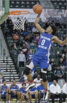  ?? JOHN BLAINE — FOR THE TRENTONIAN ?? Trenton Catholic’s Khalif Battle dunks the ball against Trenton during the MCT final at Cure Insurance Arena on Thursday night.