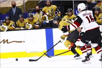  ?? Chase Stevens Las Vegas Review-journal @csstevensp­hoto ?? LEFT: Knights defenseman Nicolas Hague tries to control the puck as Coyotes center Derick Brassard pursues during the second period.