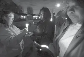  ?? COMMERCIAL APPEAL ?? There was a candleligh­t vigil for a Memphis murder victim in 2012. MIKE BROWN / THE