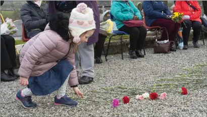  ??  ?? Eimear Flynn laying some flowers.