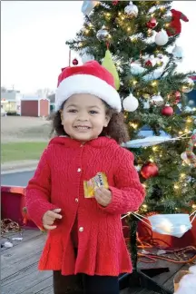  ??  ?? Mia Cardenas, daughter of Elizabeth Cardenas, unit director of the John & Maxine Watson Black Unit of the Boys & Girls Club of Benton county, rode on the float during the annual Pea Ridge Christmas Parade.