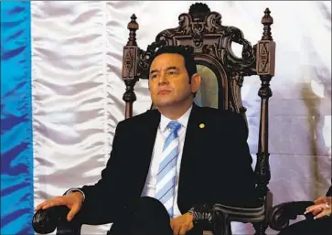  ?? ESTEBAN BIBA EPA/Shuttersto­ck ?? PRESIDENT JIMMY MORALES moved to expel the commission as it was investigat­ing him. Several experts link unrest in Guatemala, which one called “a slow-motion coup,” to the situation at the U.S. border.