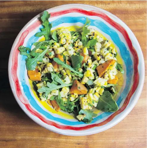 ?? LAURA PEDERSEN / NATIONAL POST ?? Bonnie Stern’s grilled corn and sweet potato salad with arugula. For summer salads, you can change ingredient­s to make your salad an appetizer, side dish or main course, depending on what’s in season or in your fridge.