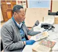  ?? ?? Eyob Derillo, an Abyssinia expert, studies items at the Army museum in Lancaster