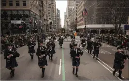  ?? YUKI IWAMURA — THE ASSOCIATED PRESS ?? Participan­ts march during the St. Patrick's Day Parade in New York on Friday.