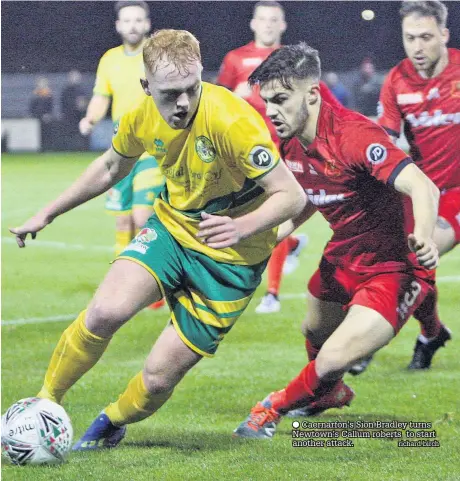  ??  ?? ● Caernarfon’s Sion Bradley turns Newtown’s Callum roberts to start another attack. richard birch