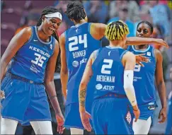  ?? SEAN D. ELLIOT/ THE DAY ?? Connecticu­t Sun forward Jonquel Jones, left, celebrates a 3-pointer by DeWanna Bonner (24) against the Indiana Fever during a WNBA game May 20.