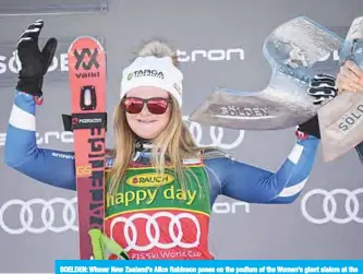  ??  ?? SOELDEN: Winner New Zealand’s Alice Robinson poses on the podium of the Women’s giant slalom at the FIS ski World cup yesterday in Soelden, Austria. —AFP