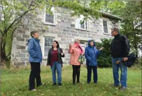  ?? MATHEW MCCARTHY, RECORD STAFF ?? Janis Price, left, Wanda Jackson-Hewer, Anne Hood, Connie Price and Stephen Hood are descendant­s of families who lived in the historic Guelph farmhouse. They are hoping to save pieces of the building ahead of its demolition.