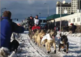  ?? RACHEL D’ORO - THE ASSOCIATED PRESS ?? FILE - In this March 7, 2015, file photo, musher Peter Kaiser, of Bethel, Alaska, leads his team past spectators during the ceremonial start of the Iditarod Trail Sled Dog Race, in Anchorage, Alaska.