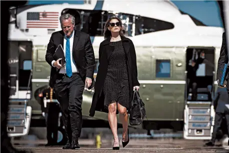  ?? DOUG MILLS/THE NEW YORK TIMES ?? Senior adviser Hope Hicks, who recently tested positive for COVID-19, walks with White House chief of staff Mark Meadows on Thursday in Maryland.