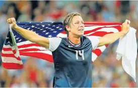 ?? /Reuters ?? Medal detector: Abby Wambach on parade after the US beat Japan for the gold medal at the London Olympic Games in 2012.