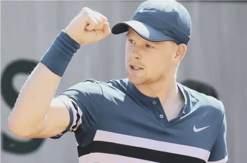  ??  ?? 0 British No 1 Kyle Edmund celebrates after winning a point during his first-round victory over Australian teenager Alex De Minaur.