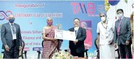  ??  ?? Union Finance Minister Nirmala Sitharaman on Sunday releasing a special TMB postal stamp and card on the occasion of TMB’s centenary celebratio­n in Thoothukud­i on Sunday