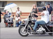  ?? NEWS PHOTOS MO CRANKER ?? Friends wave to Mike and Lee Durst (under the umbrella) Friday evening outside of AgeCare Valleyview. Mike has been living with ALS for the past two years.