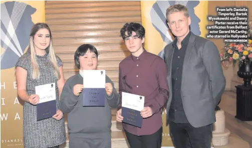  ?? PETER MORRISON ?? From left: Daniella Timperley, Bartek Wysokowski and DannyPorte­r receive their certificat­es from Belfastact­or Gerard McCarthy, who starred in Hollyoaks