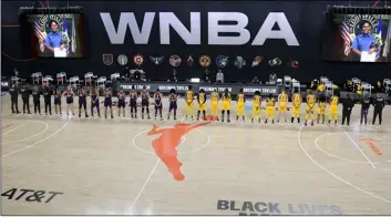  ?? AP Photo/Phelan M Ebenhack ?? Members of the Phoenix Mercury (left) and Los Angeles Sparks stand for a moment of silence in honor of Breonna Taylor before a WNBA basketball game, on July 25 in Ellenton, Fla.