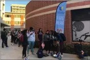  ?? STEFANIE DAZIO — THE ASSOCIATED PRESS ?? Voters wait on line at a polling station at the University of Southern California on Tuesday.