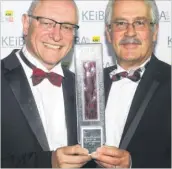  ?? FM4396566 ?? Tom Cole, left, and Greg Smith of ITL with one of the Ashford company’s two awards