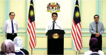  ?? — Bernama photo ?? Mohd Radzi (centre) at the press conference at his ministry in Putrajaya yesterday. Also seen are his deputies Datuk Dr Mah Hang Soon (le ) and Muslimin Yahaya.