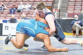  ?? TO THE MORNING CALL DAVID GARRETT / SPECIAL ?? Nazareth’s Sean Kinney, right, takes down Hempfield Area’s Isaiah Vance in their 285-pound semifinal Saturday at Hershey’s Giant Center.