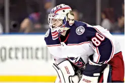  ?? AP Photo/Kathy Willens, File ?? ■ Columbus Blue Jackets goaltender Matiss Kivlenieks is shown during an NHL game Jan. 19, 2020, in New York City. The Blue Jackets and Latvian Hockey Federation said Monday that 24-year-old goaltender Kivlenieks has died. The team said in a statement Kivlenieks died from an apparent head injury in a fall.