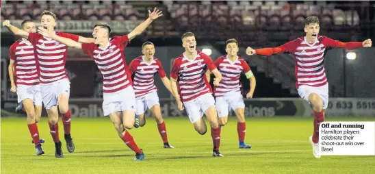  ??  ?? Off and running Hamilton players celebrate their shoot-out win over Basel