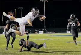  ?? Robert Gauthier Los Angeles Times ?? TATE MARTELL of Bishop Gorman soars during a game two years ago against Servite at Cerritos College. Martell’s team returns to the Southland this weekend.