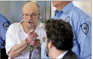  ?? Arkansas Democrat-Gazette/STATON BREIDENTHA­L ?? Condemned murderer Jack Greene talks about his lawyers, including John Williams (foreground), during his clemency hearing Wednesday at the Arkansas Department of Correction’s Varner Unit.